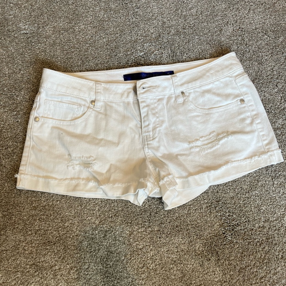 White distressed jean shorts